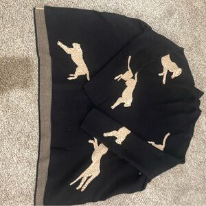 Black sweater with animal print